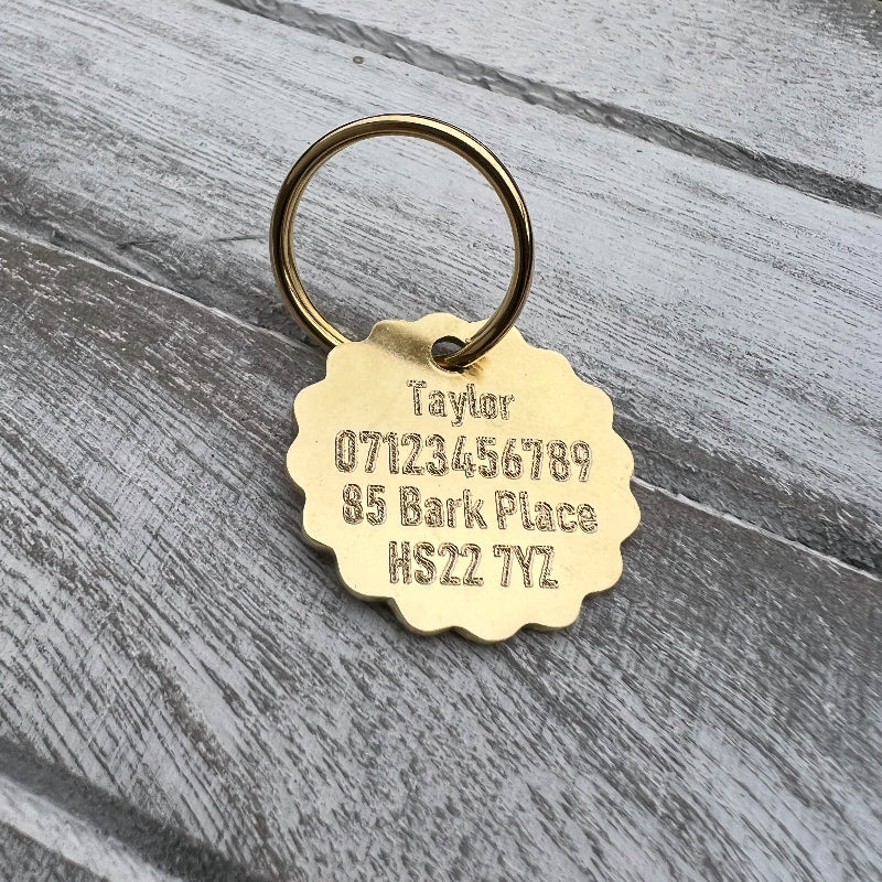 Brass Flower with Text on Wooden Background